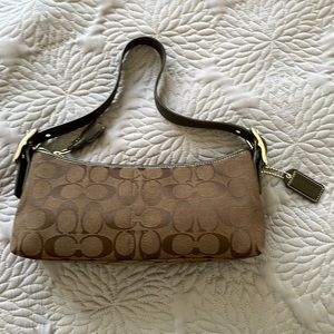 Coach original signature denim shoulder bag with leather handle.